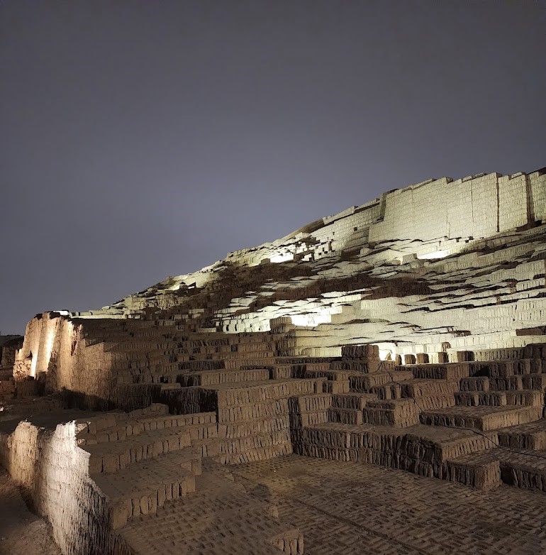 Ancient pyramid of Huaca Pucllana illuminated at night